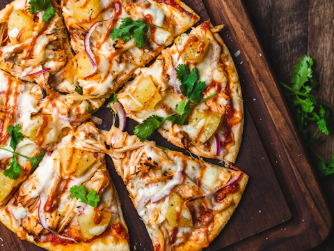 Pizza on a chopping board; illustrative stock photo, not a Royal King pizza or panzerotti.